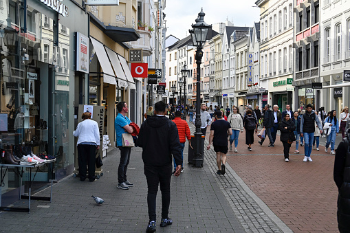 Maastricht, Netherlands, April 13, 2022; Pedestrians in the pleasant shopping street in the center of Maastricht.