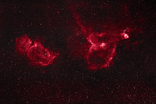 A cosmic background with the stars with red colors on a black surface
