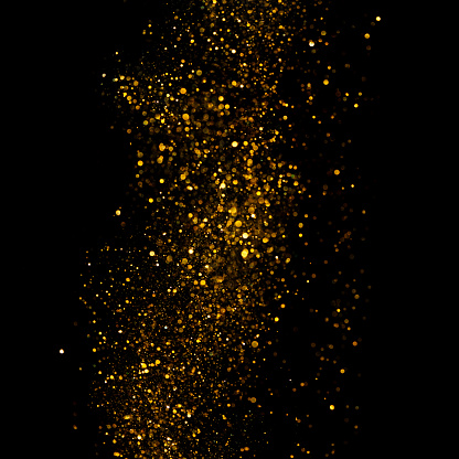 Golden glitter and bokeh rain border abstract design element isolated on black background