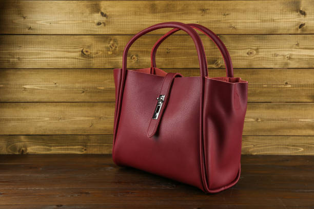 istock women's hand bag on a wooden background 1438966154