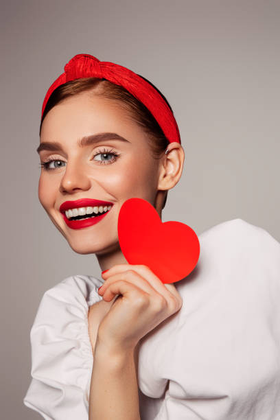 istock Beautiful emotional woman holding present box 1438966235