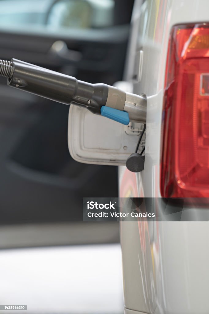 Fuel up the natural gas vehicle (NGV) at the station. `Price increase concept Car Stock Photo