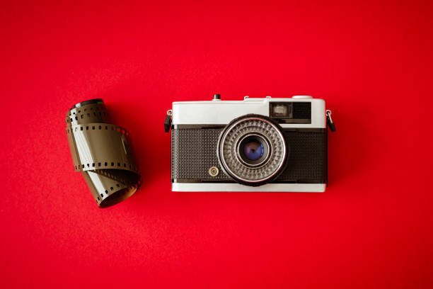 istock Vintage film camera on red background 1438967469
