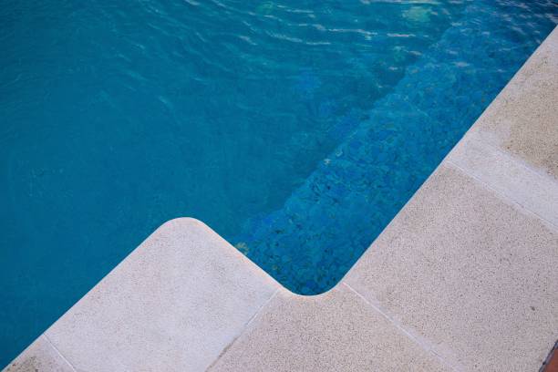 istock Edge of a clear water pool, summer time 1438967553