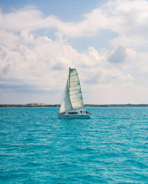 Catamaran sailing around Isla Mujeres, Mexico stock photo