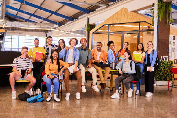 istock Laughing group of diverse young college students hanging out at school 1438969084