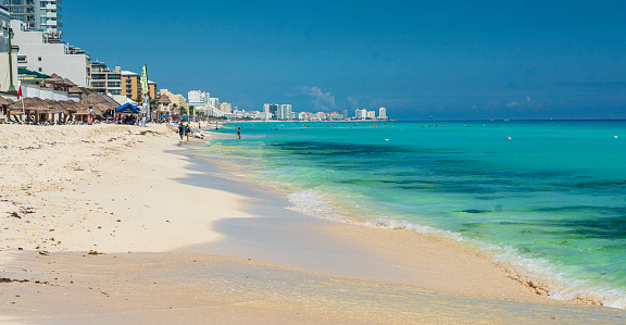 Coastline of Cancun, Mexico Hotel Zone at Sunrise with Multiple Resorts in the background.