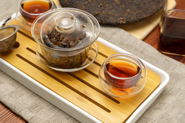 istock Chinese Tea Ceremony. Pu erh on wooden background. Selective focus 1438969452