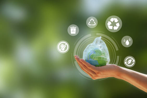 istock Zero waste. hand holding the earth that plastic bag covering  on a green background. Concept of Reuse Reduce Recycle Rot Refuse. Zero waste. Conscious consumption. 1438976189