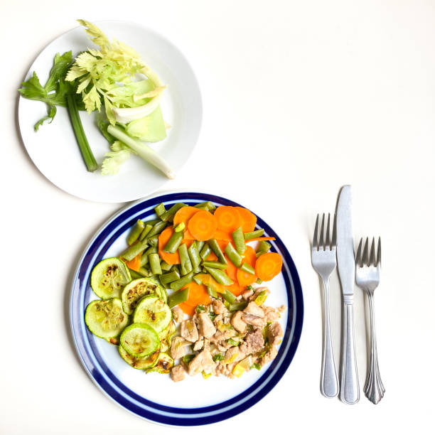 Healthy Homemade Chicken Breast and Rice with Broccoli on a light background. Top view.
