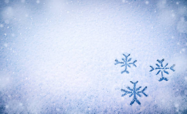 istock Three snowflakes painted on snow on the car.  Copy space. 1438976686