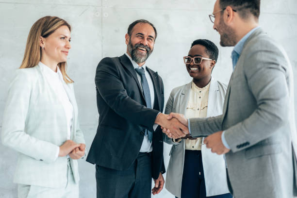 istock Business people shaking hands 1438978220