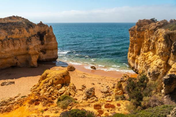 istock Aerial view of beach surrounded by cliffs at beach Coelha 1438978585