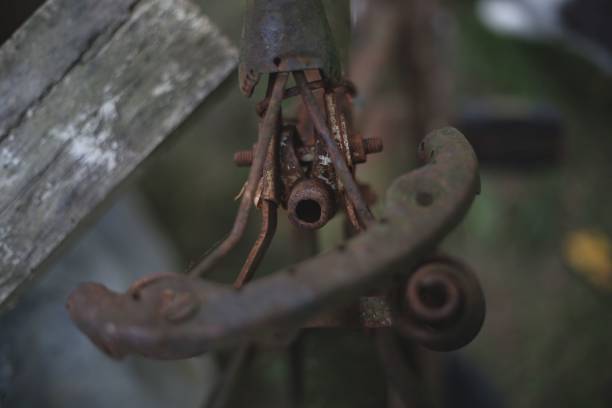 An old broke and rusty saddle of a brown bicycle