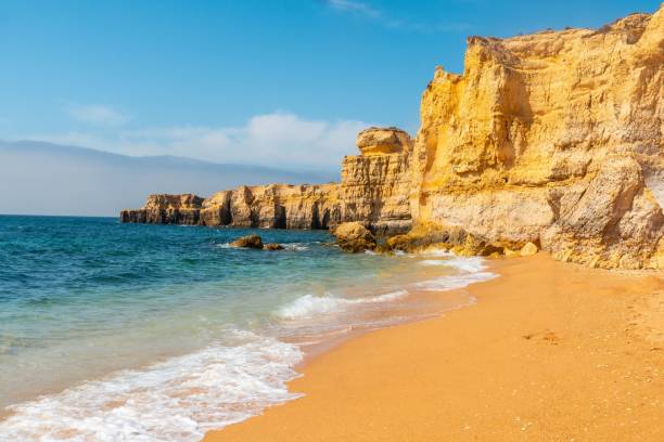 istock Aerial view of beach surrounded by cliffs at beach Coelha 1438979620