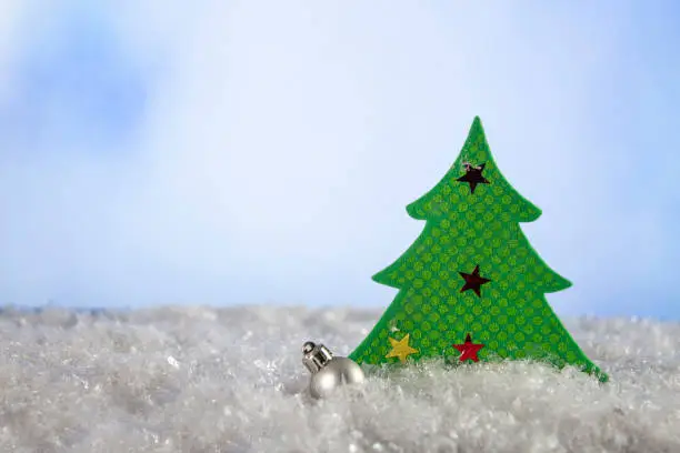 Christmas background. Christmas tree in the snow. Decorations for the New Year. copy space