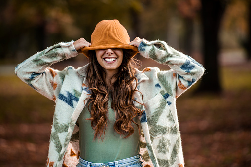 Happiness, woman with hat in autumn
