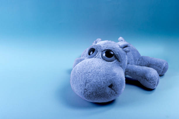 istock Blue Monday concept. Sad teddy bear on blue background. 1438984190