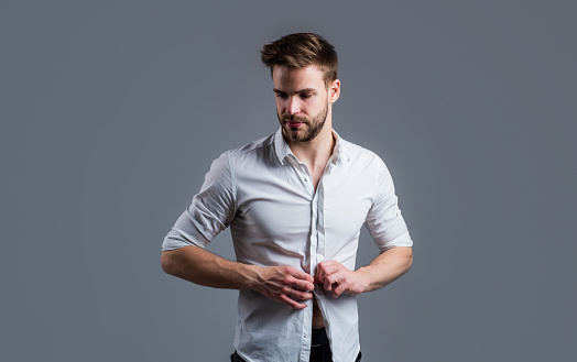 young handsome man in formal wear has bristle on face, grooming.