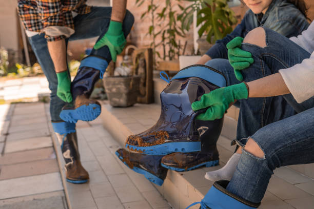Family removing muddy boots