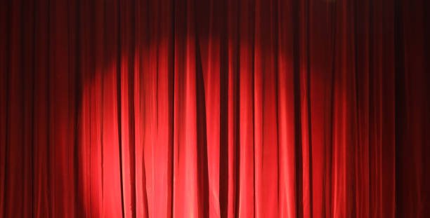 istock Maroon red curtains in theater cinema drapes. Art performance background. Textured textile backdrop 1438986513