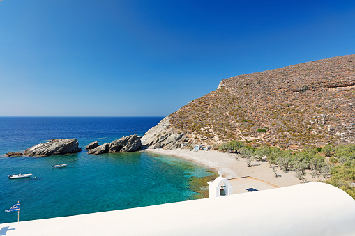 The sandy beach with the church Agios Nikolaos in Folegandros island, Greece