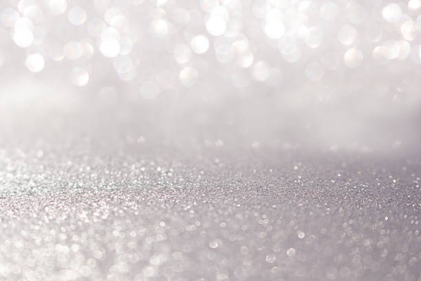 istock Blurred silver glitter background with sparkle. Christmas, New Year, March 8, birthday, International Women's Day. Copy space 1438987900