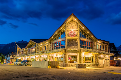Illuminated stores in downtown Canmore, Alberta, Canad at night.