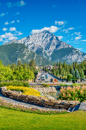 Banff Avenue and Cascade Mountain in downtown Banff, Alberta, Canada on a sunny day.