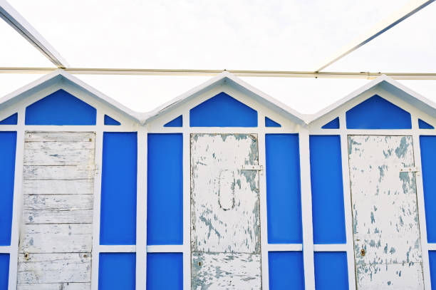 A row of beach huts that line the sandy beach at Hardelot which is situted next to Le Touquet in Northern France.