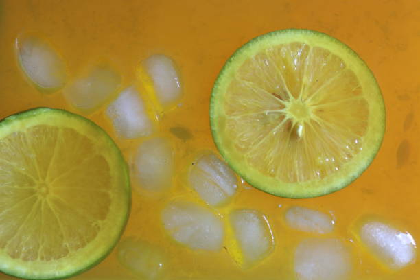 istock Fresh orange slices in orange juice with ice cubes 1438991267