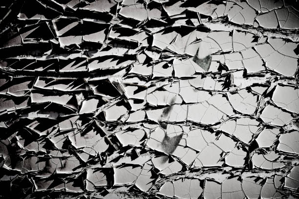 istock Closeup wall section with heavy peeling white paint 1438993368