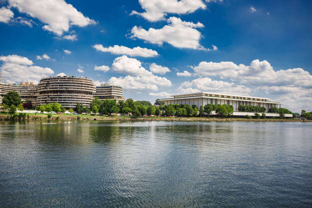 Watergate Hotel and Kennedy Center in Washington, DC The Watergate Hotel and John F. Kennedy Center for the Performing Arts from the Potomac River in Washington, DC hotel watergate stock pictures, royalty-free photos & images