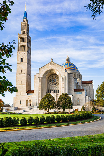 Exterior of the Basilica of the National Shrine of the Immaculate Conception, a Catholic church in Washington, DC on a beautiful autumn day