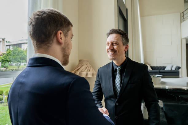istock Businessmen closing deal 1439001173