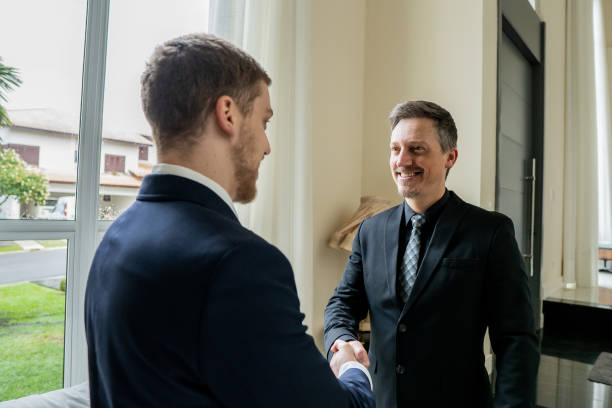 istock Businessmen closing deal 1439001180
