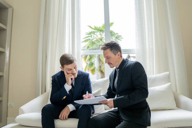 istock Father and son checking documents in luxury room 1439001217