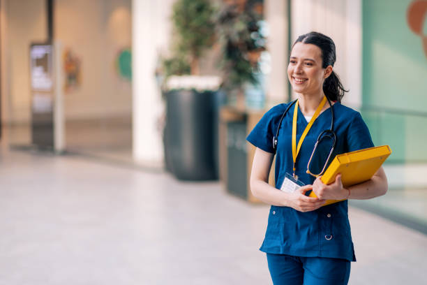 istock Smiling friendly doctor in front of an ambulance 1439001477