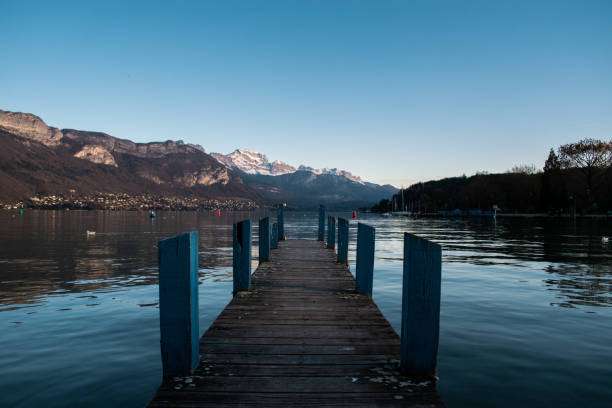 istock Pier on the lake with reflection during daytime 1439003135
