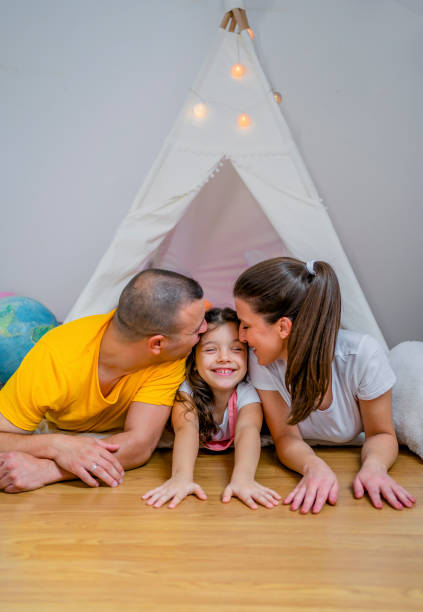 istock Young family enjoying at home 1439003166