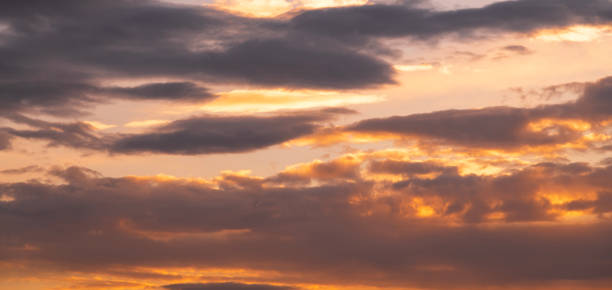 istock Beautiful dramatic sunset sky with clouds. Sunset sky background. 1439005715