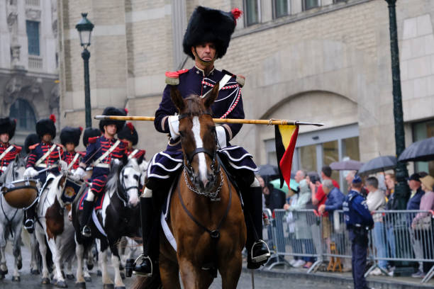 Royal Horse Guards during a ceremony Royal Horse Guards during a ceremony  in front of S t Michael and St Gudula Cathedral in Brussels, Belgium on July 21, 2022. song title stock pictures, royalty-free photos & images