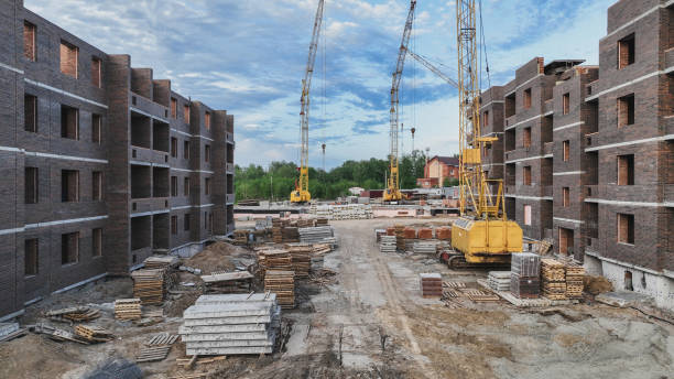 istock Construction site of low-rise brick houses in summer time 1439006614
