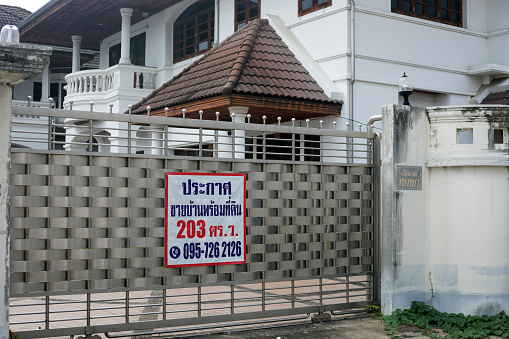 Big older residential home for sale in Bangkok. Scene is in residential district in Bangkok Chatuchak