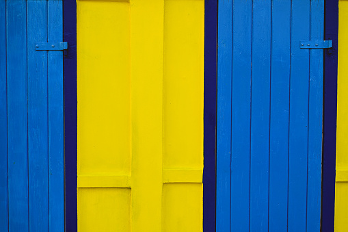 close up of a blue and yellow colored outdoor building.
