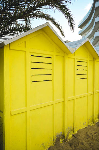 istock yellow beach huts on a bright sunny day 1439008522