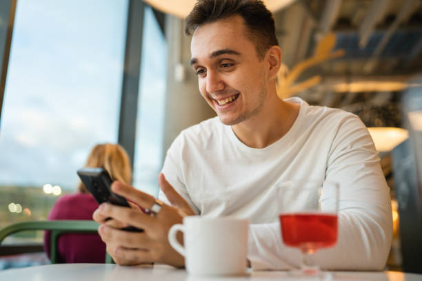 istock one man young adult caucasian using mobile phone smartphone 1439008595