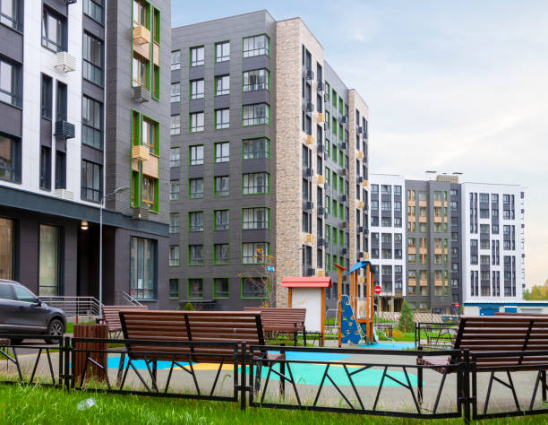 Low-rise houses mixed-use urban multi-family residential district area development with bench rest place stock photo