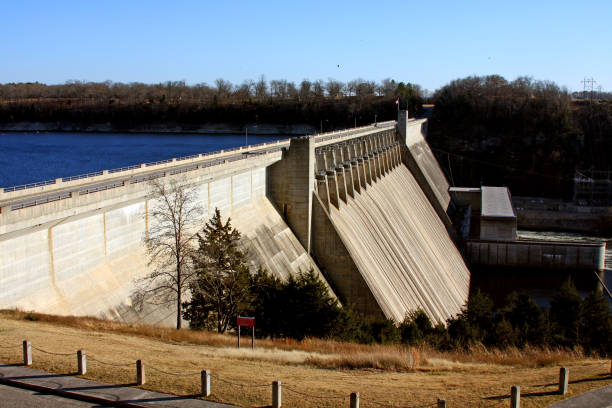 istock Old rural hydroelectric dam by a river surrounded by thick trees 1439010374