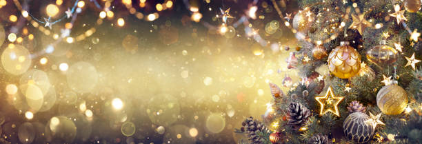 istock Golden Christmas Tree With Baubles In Shiny Festive Background 1439011290